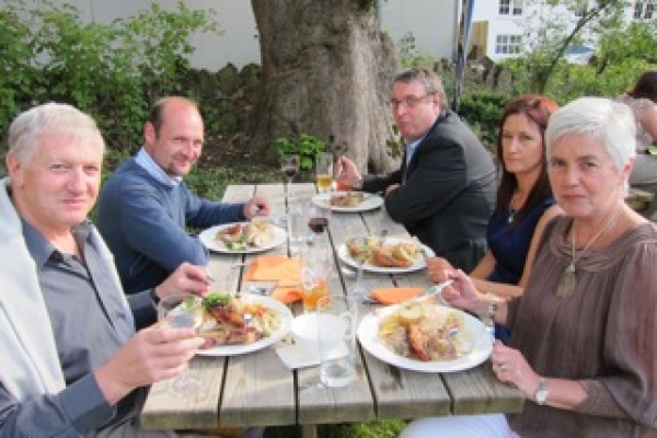 Representative of Kilkeel seafood companies Henning & Rooney enjoy some 'turf' with Head of Food Marketing at Invest NI, Nigel Hardy
